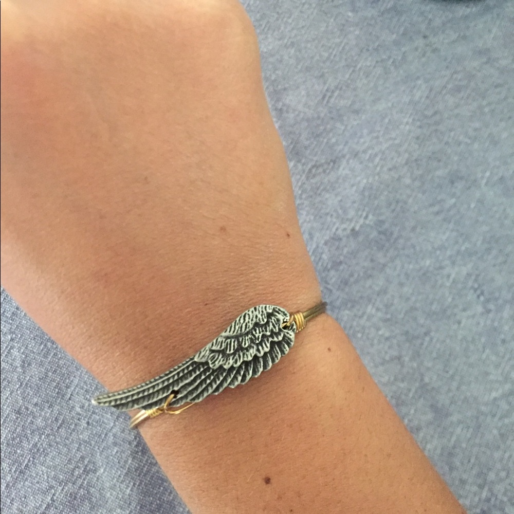 Gold wing bracelet NEVER USED